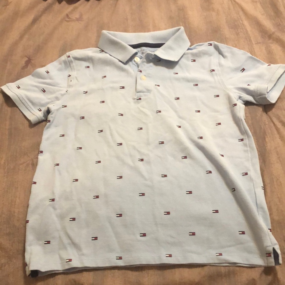 Boy’s Tommy Hilfiger short sleeve polo shirt, light blue with flag logo pattern.